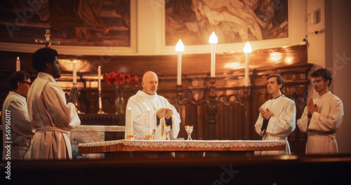 The Eucharist In Grand Church: Ministers of Christian Faith lead The Ceremony that Involves Sharing Bread And Wine In Honor of Jesus Christ. Holy Communion, Divine Mass, Lord's Supper at the Altar