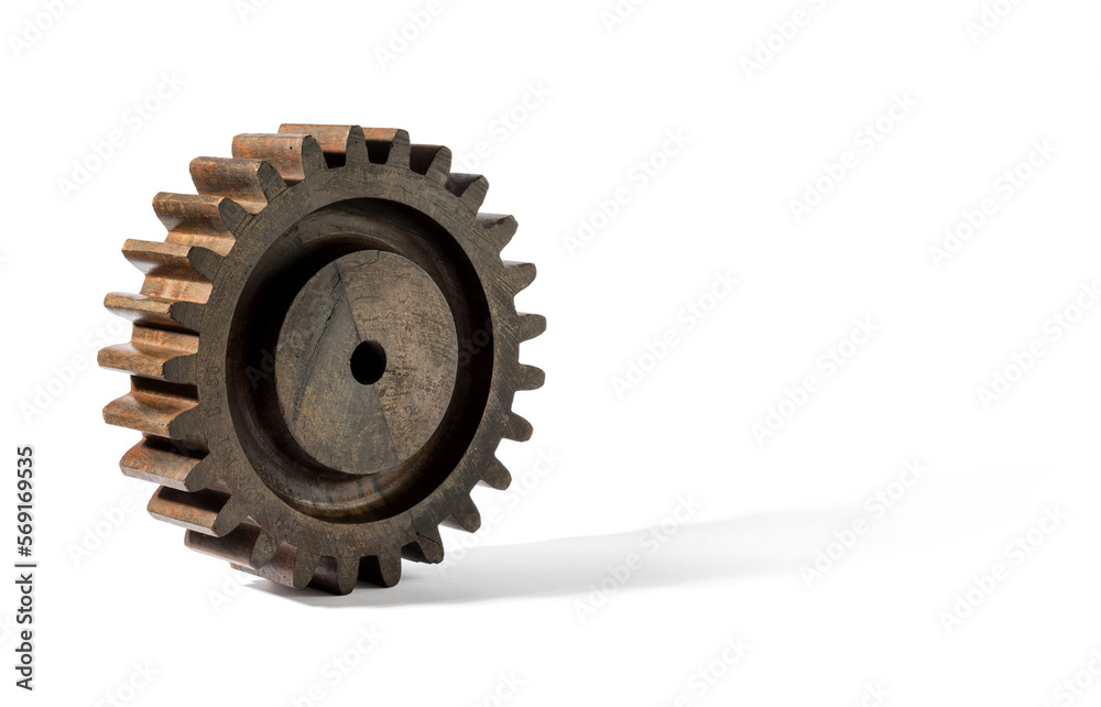 Wooden cog rolling on white background Wooden cog rolling on white background