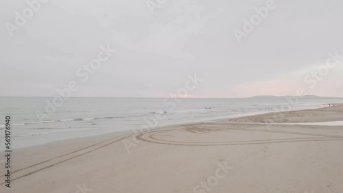 Drone view of sandy empty beach on a sunset, Portugal