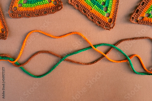 Top view of tree crochet cords and parts of multicolored crochet photo