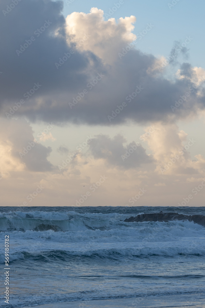 Foamy sea waves at the early evening