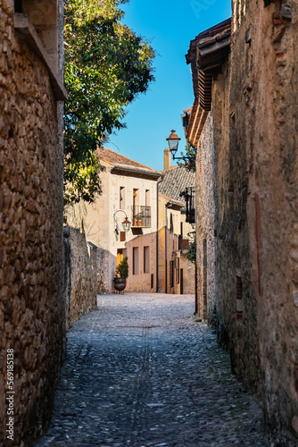 Narrow alley with stone buildings in the medieval town of Pedraza  Castile and Leon  Spain.