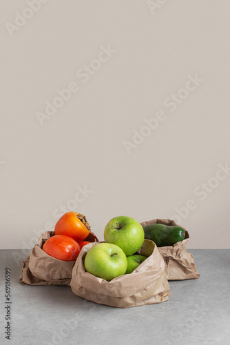 zero waste packaging. Different vegetables and fruits in paper bags on the table