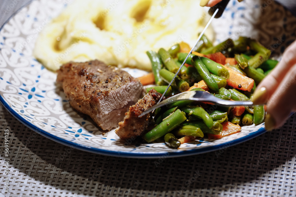 Potatoes with meat and vegetables on the table