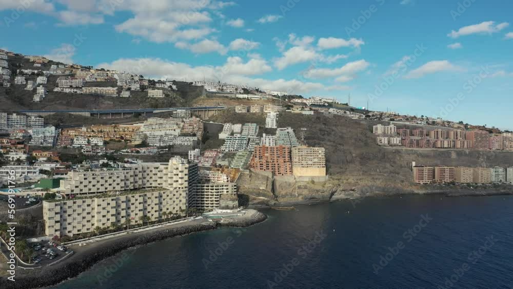aerial resort city on cascade rocky hills at quiet ocean aerial resort city on cascade rocky hills at quiet ocean