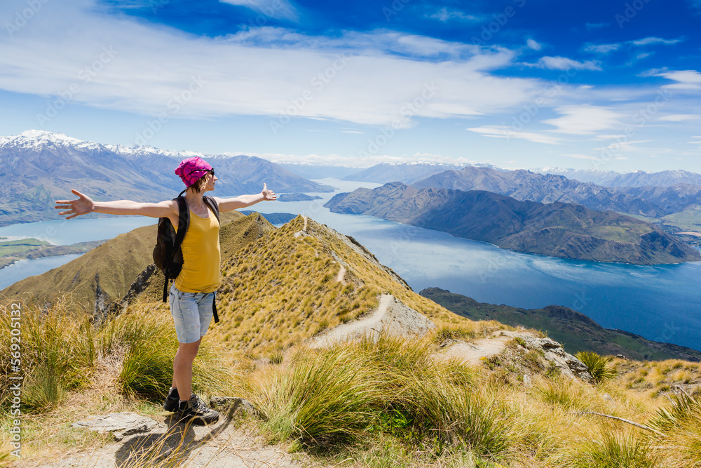 Tourist with a backpack and mountain panorama. New Zealand