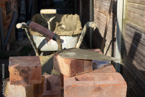 Building site: bricks and mortar for an extension, part of a renovation of an Edwardian suburban house in north London, UK