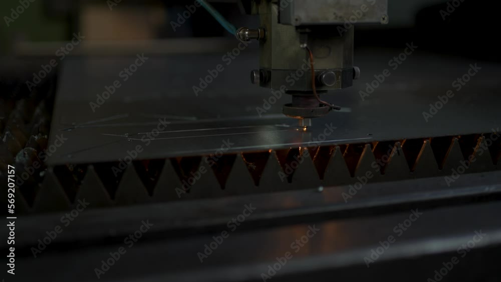 Industrial CNC laser cutting machine cuts metal sheet Industrial CNC laser cutting machine cuts metal sheet
