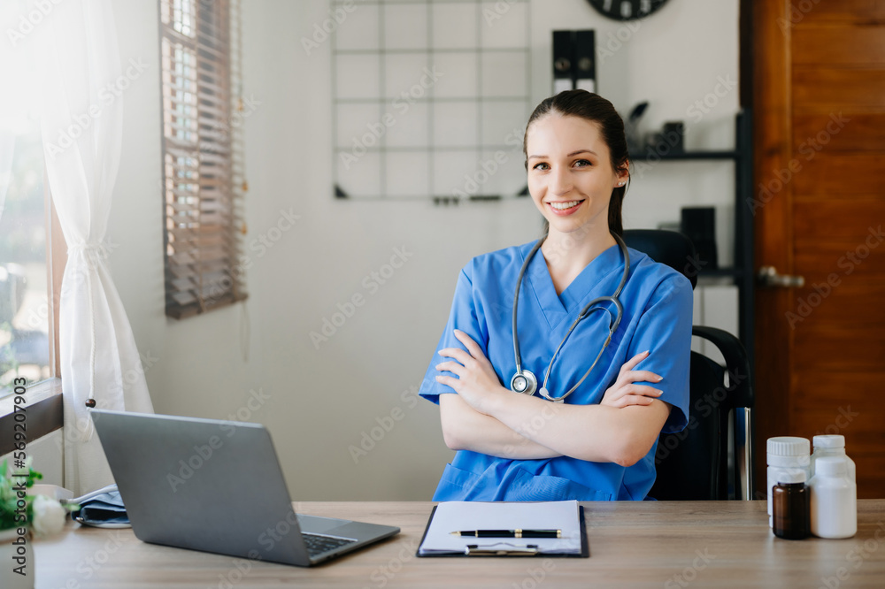 Asian smiling doctor or consultant sitting at a desk his neck looking at the camera Asian smiling doctor or consultant sitting at a desk his neck looking at the camera