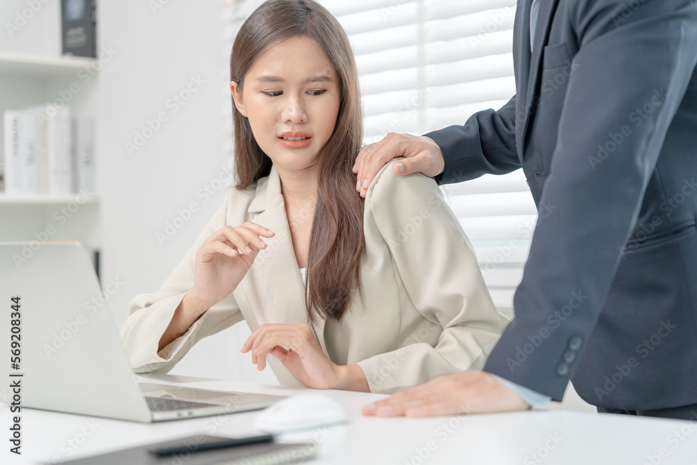 businessman sexually harassed a female colleague by touch her shoulder. Sexual harassment in office. Women feel anxious and stressed from being harassed. molest, assault, inappropriate, discrimination businessman sexually harassed a female colleague by touch her shoulder. Sexual harassment in office. Women feel anxious and stressed from being harassed. molest, assault, inappropriate, discrimination