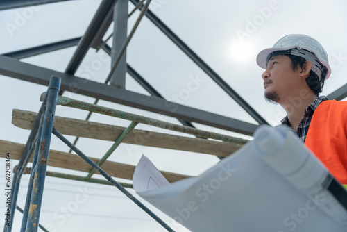 Engineers use blueprint check construction on site. Contractor and inspector inspection construction during project.civil Forman check quality assurance. Audit, inspect, quality control..