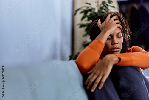 African woman struggling with depression after too much responsibility at work,