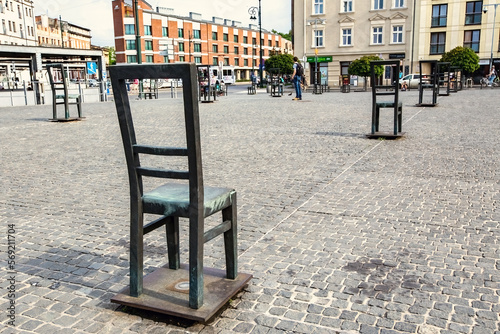 Ghetto heroes square with lots of symbolic chairs in Krakow, Poland photo