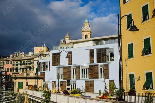 Landscape with colored facades of houses in Europe. Panorama of the city of Genia in Italy. View of the old town. Houses on the hill.
