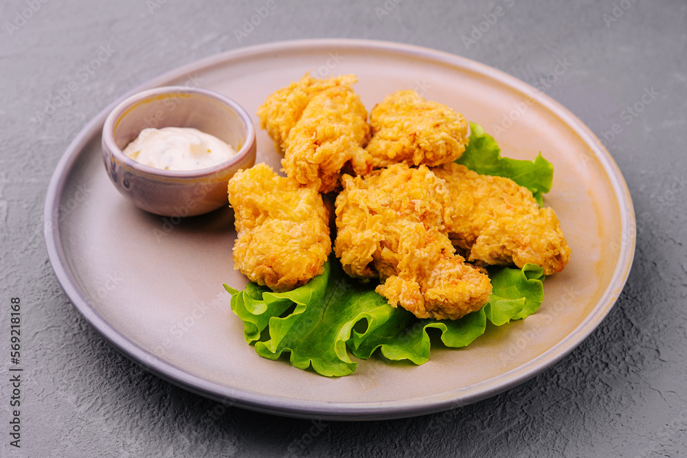 Delicious crispy fried chicken breast strips with sauce Delicious crispy fried chicken breast strips with sauce