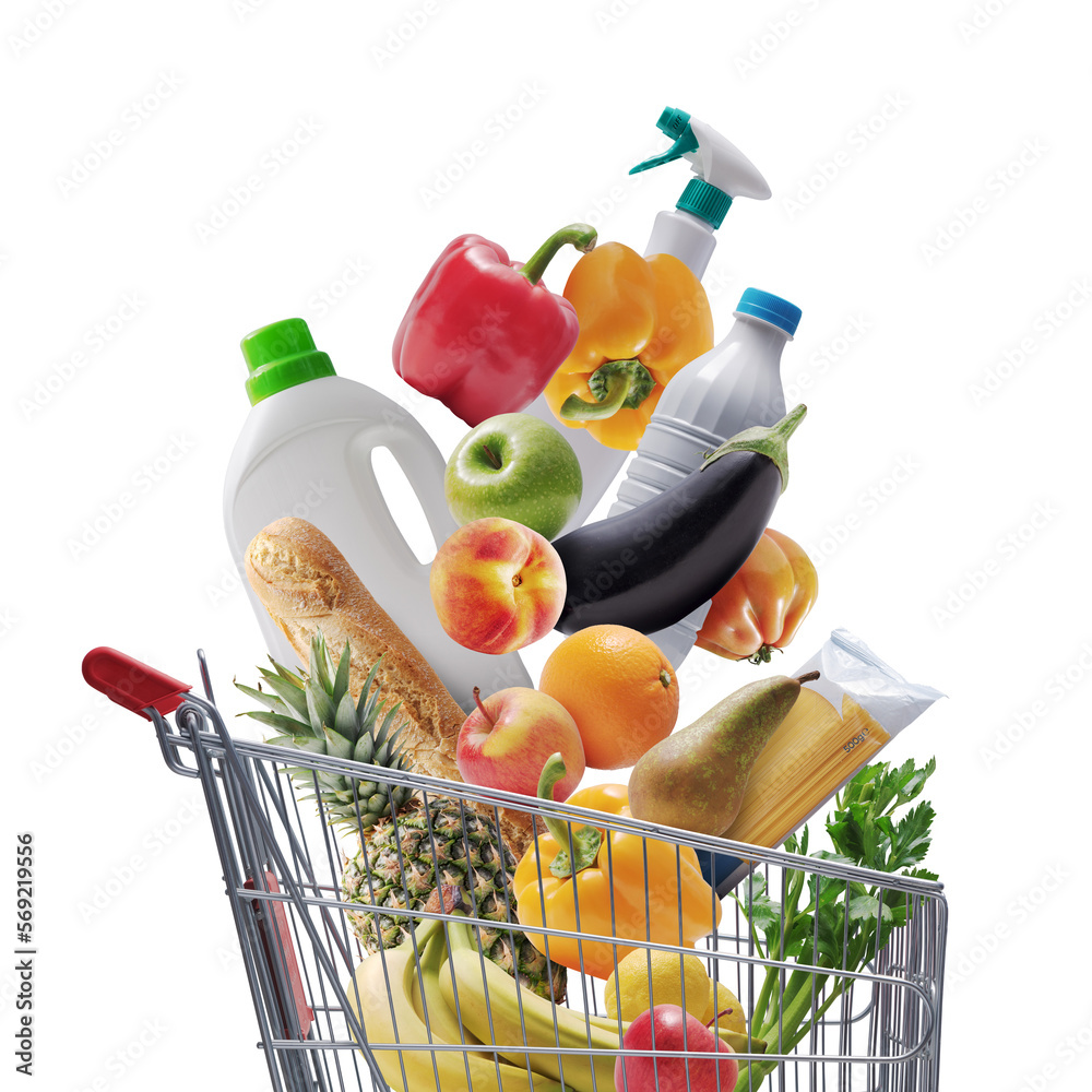 Groceries and goods falling in a shopping cart - obrazy, fototapety, plakaty 