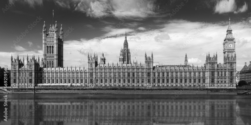 Westminster palace, relections in the river Thames  in London, UK. Black and white photography