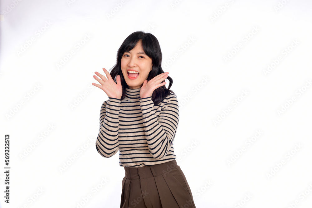Happy young asian woman, professional entrepreneur standing in casual clothing, open mouths raising hands shout announcement, white background Happy young asian woman, professional entrepreneur standing in casual clothing, open mouths raising hands shout announcement, white background