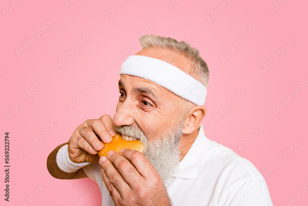 Weightloss, healthcare, gym, strength, regime, challenge. Close up of modern athlete cool grey haired pensioner grandpa hold yummy tasty delicious heavy grossy sandwich, destroys it Weightloss, healthcare, gym, strength, regime, challenge. Close up of modern athlete cool grey haired pensioner grandpa hold yummy tasty delicious heavy grossy sandwich, destroys it
