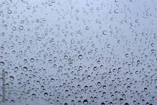 Raindrop window. Water droplets on a window. Rainy days.