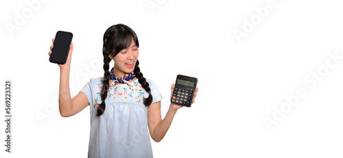Portrait of beautiful young asian woman in denim dress holding calculator and smartphone on white background. business shopping online concept.