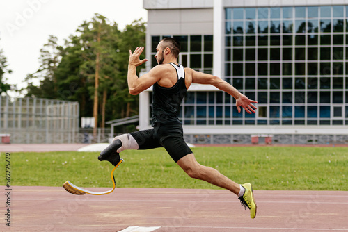 male paraathlete run-up long jump