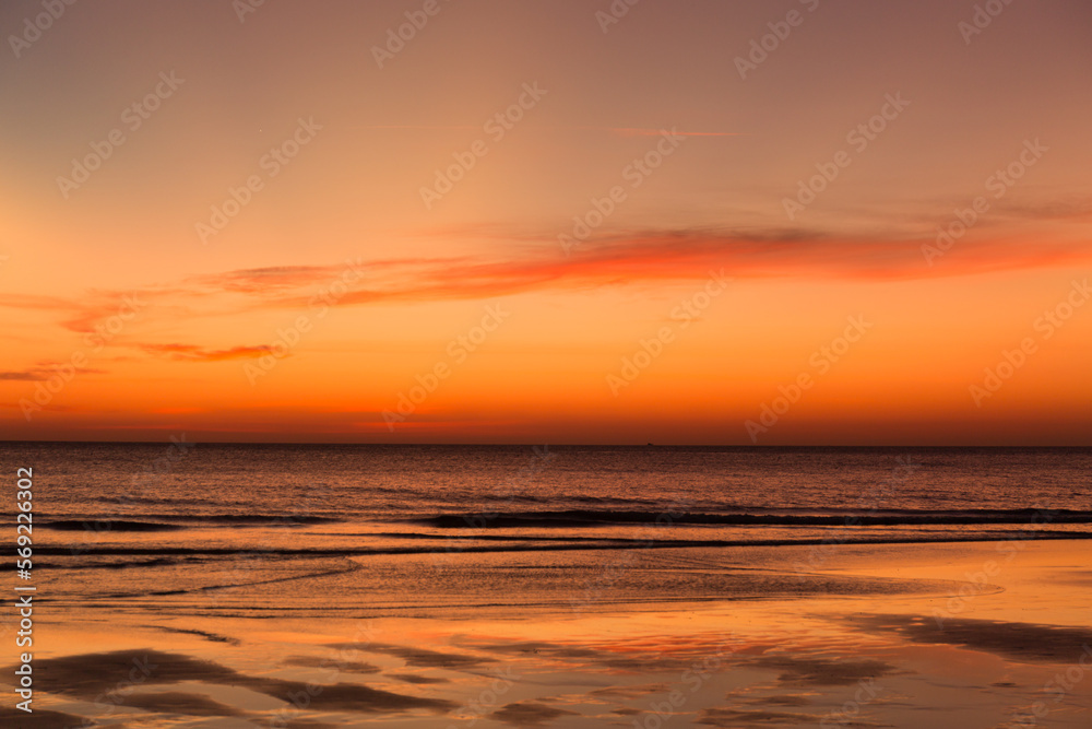 Calm sea with sunset sky with cloud.