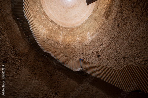 Interior of a Snow Well in Sierra Espuna, Region of Murcia, Spain. View of the medieval brick dome and the access staircase to the interior photo