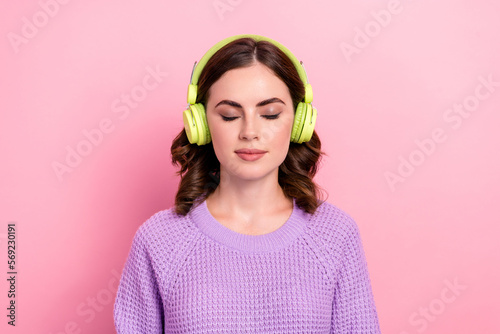 Photo of pretty cute calm lady wear stylish spring clothes enjoy favorite ukrainian hits modern device isolated on pink color background