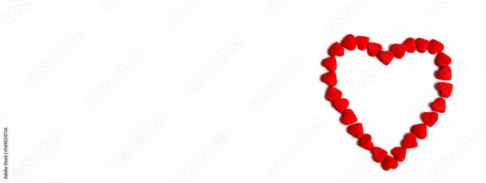 Banner of red hearts forms a heart shape on a white background. Isolated heart shape. The concept of love and romance. Romantic background composition. Valentine's Day
