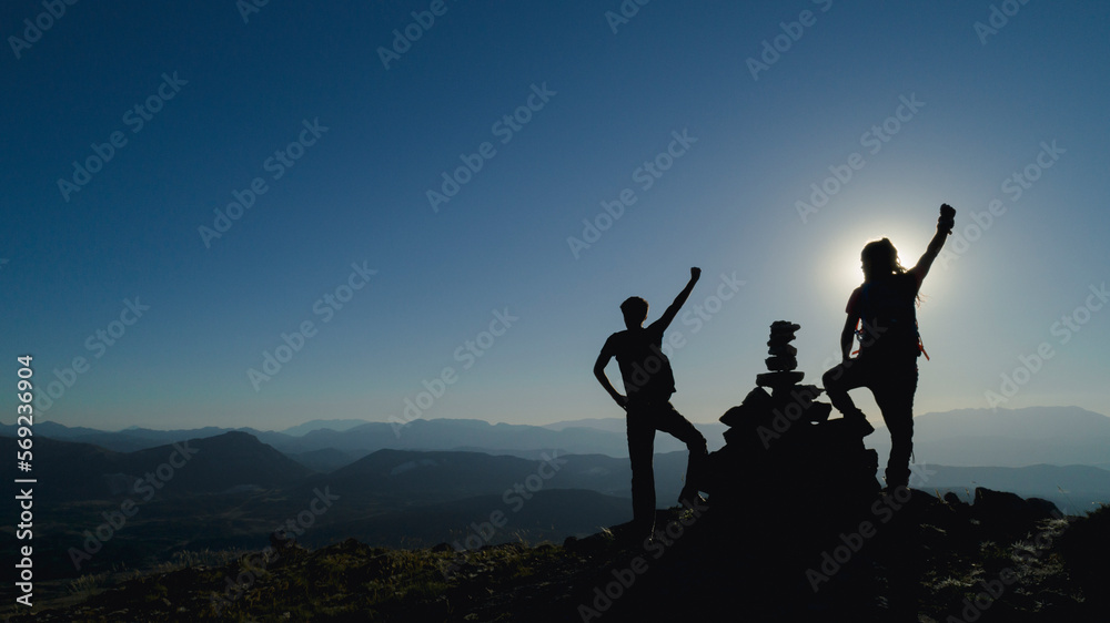 the happiness of the successful duo in sunny weather and at the summit the happiness of the successful duo in sunny weather and at the summit