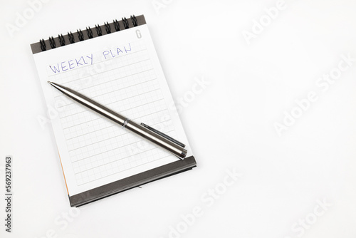 Wallpaper Mural Weekly plan notes with metal pen - Productivity plan - Business and self improvement Torontodigital.ca