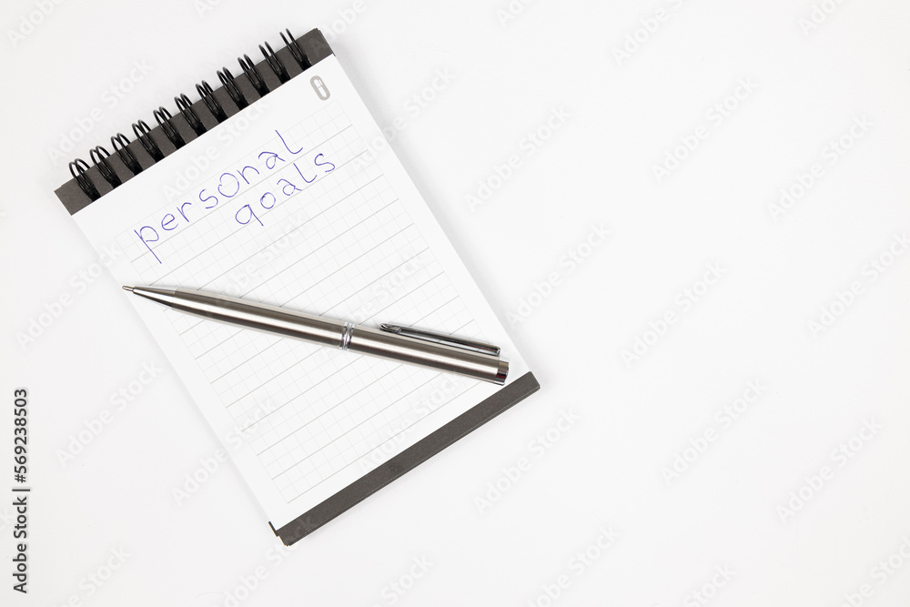 Goals 2023 plan notes with metal pen - Productivity plan - Business and self improvement Goals 2023 plan notes with metal pen - Productivity plan - Business and self improvement