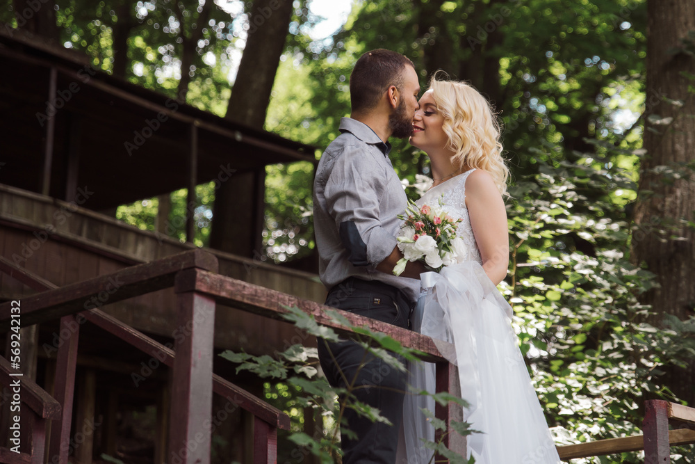 Bride and groom in nature on a sunny summer day Bride and groom in nature on a sunny summer day