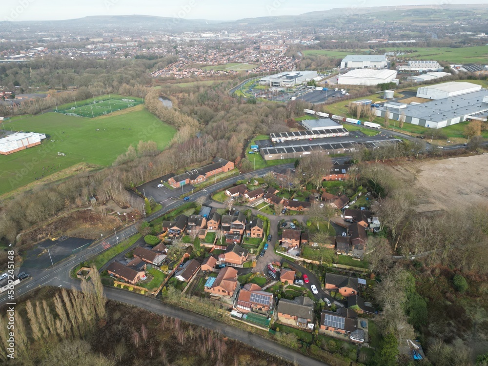Aerial view of a residential neighbourhood with buildings and green spaces. Taken in Bury Lancashire. 
