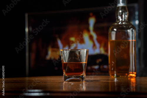 Whiskey in a glass on a wooden table