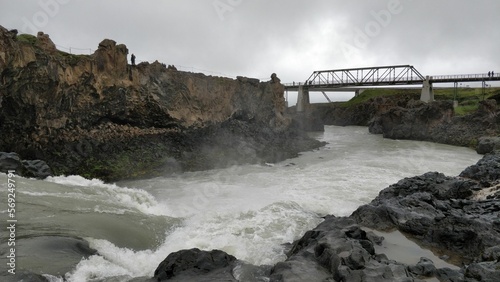 Wild river flowing under bridge downstream of Godafoss waterfalls near Akureyri, Iceland
