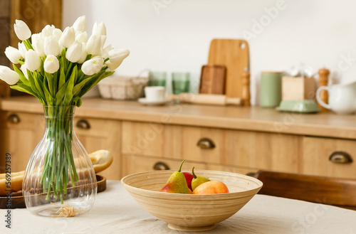 Wood table on blur kitchen room background.