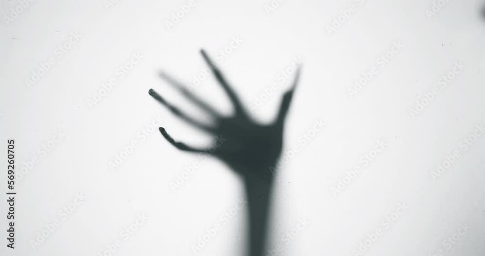 Shadow of a zombie hand on white background
Shadow of a zombie hand on white background