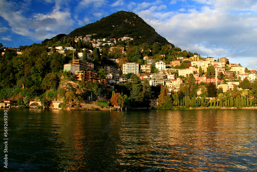 Landscape with a view of a hill with houses and Lake Lugano in the city of Lugano, in southern Switzerland	