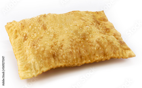 Brazilian pastry, fried dough and stuffed with meat, cheese or shredded chicken. typical brazilian salt, served in bakeries, bars and restaurants, isolated white background, copy space