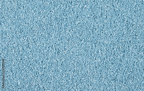 Blue sand in a random arrangement of grains.