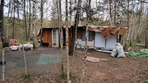 Homemade homeless dwelling next to a landfill.