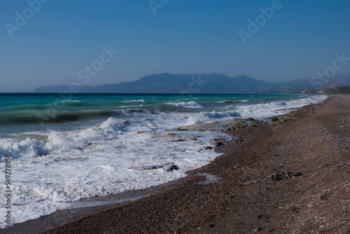 East shore of Rhodes Island with big waves and rocky beach