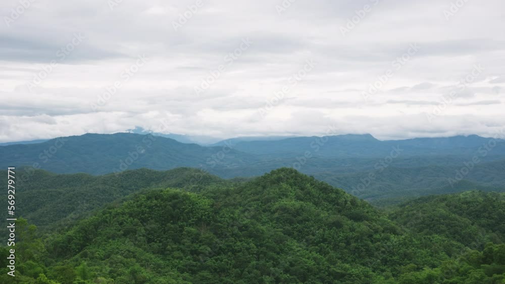 Time lapse view of a valley with mountains and a cloudy sky in the background. Typical Asian landscape. Time lapse view of a valley with mountains and a cloudy sky in the background. Typical Asian landscape.