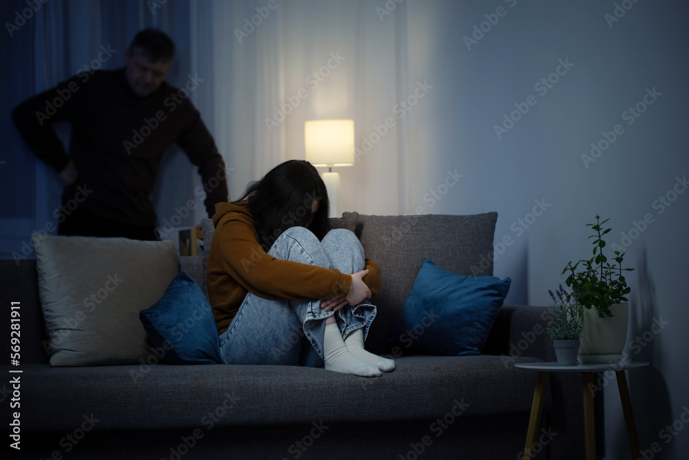 father and daughter teenager in  living room in  evening,  concept of problems in family
