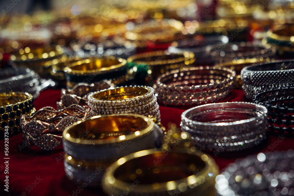 Women's jewelry, bracelets at the night market in Goa, India. Background of jewelry
