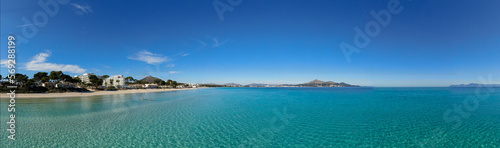 Panoramic view of Playa de Muro  in Majorca. Beautiful scene of the seacost with a blue sea and Mediterranean landscape © Enrique