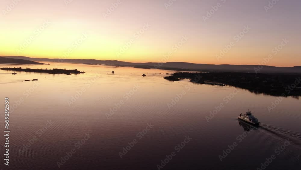 Ferry boat in Oslo fjord, Norway at sunset Ferry boat in Oslo fjord, Norway at sunset