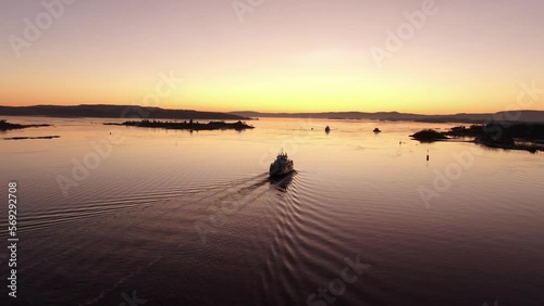 Ferry boat in Oslo fjord, Norway at sunset